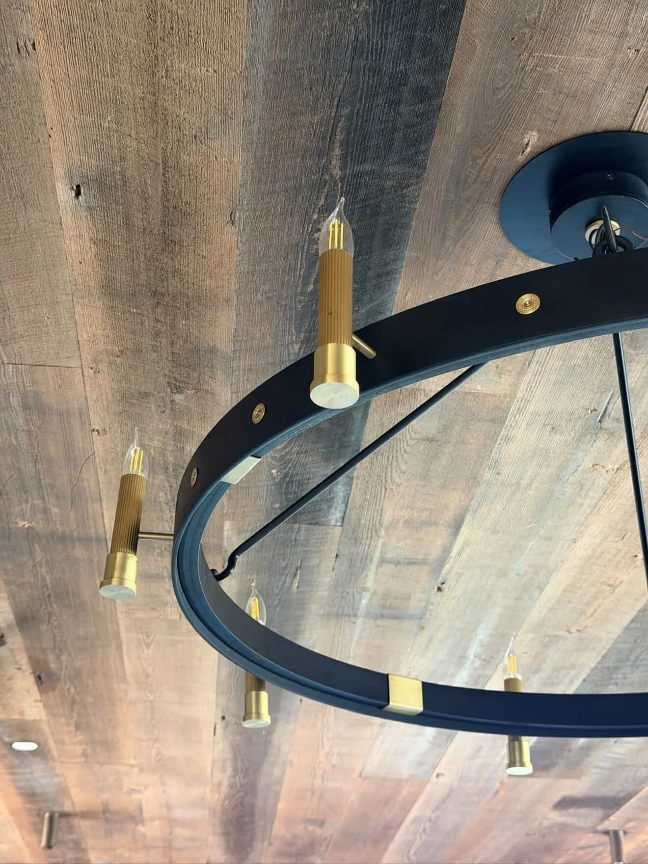 Loving how this custom steel and brass Chandelier turned out ! Check out the reeded brass candelabras designed to subtlety mimic 12gauge shotgun hulls. Instead of rivets we also used the firing cap of actual shells. Love when awesome studios like @th