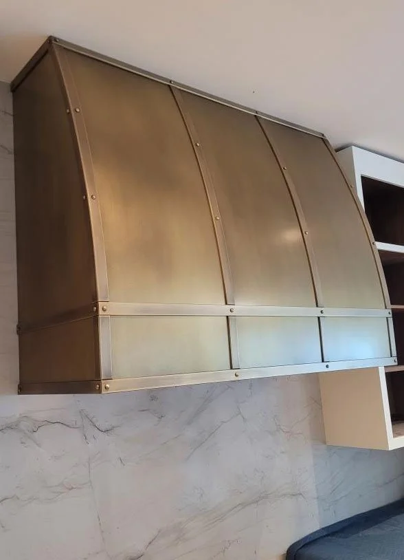 Curved - Hand Patinated Brass Vent Hood with Straps and Rivets