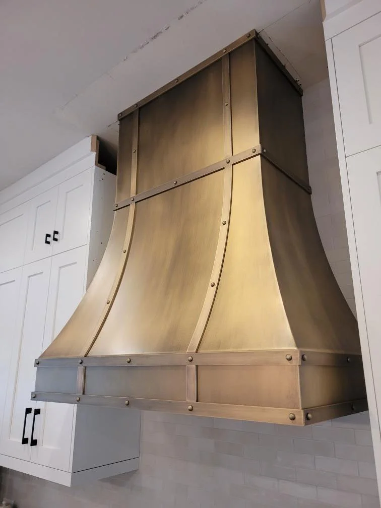 Curved - Hand Patinated Brass Vent Hood with Straps and Rivets