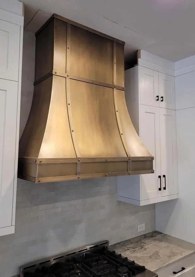 Curved - Hand Patinated Brass Vent Hood with Straps and Rivets