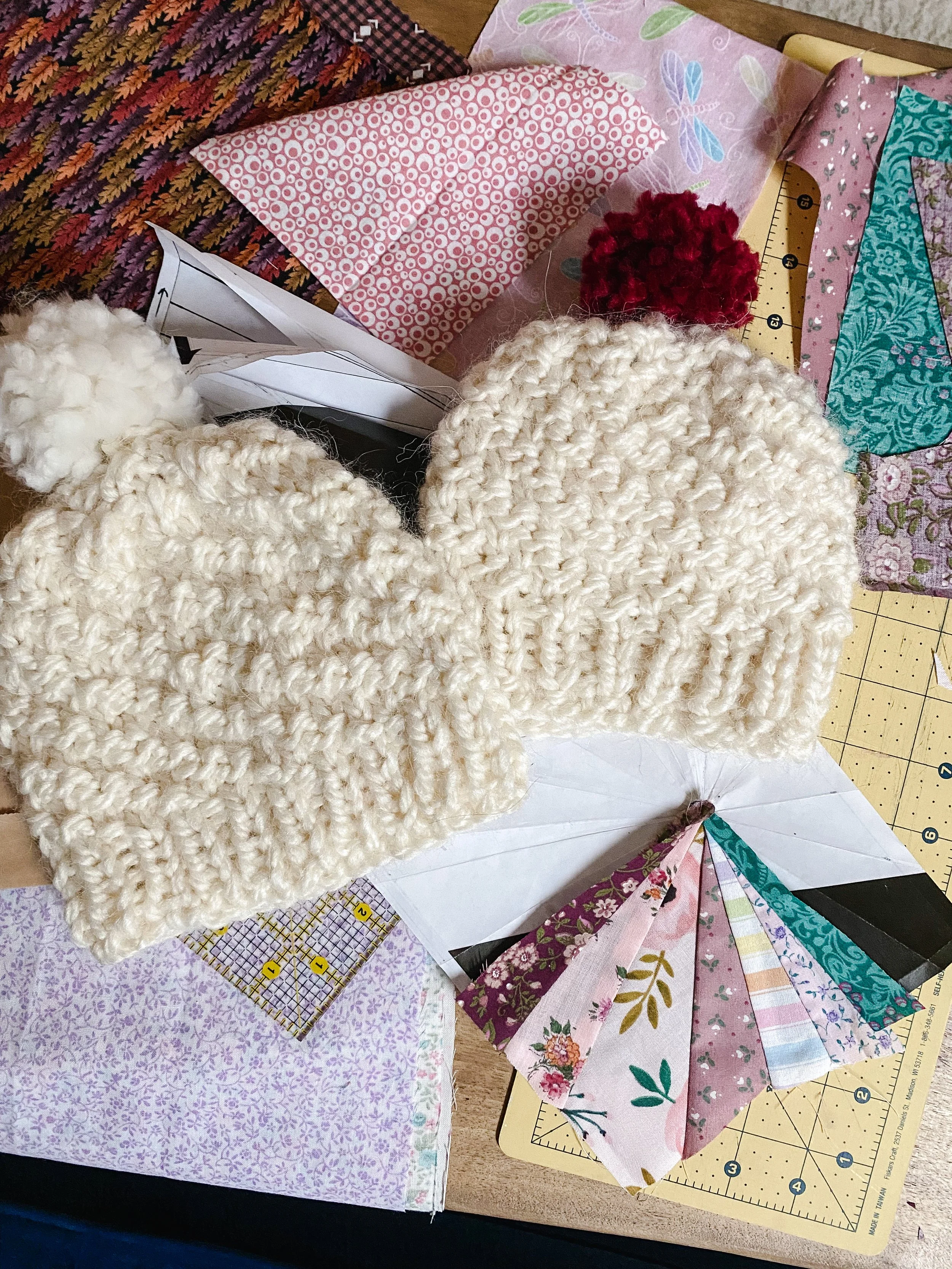 New pom-pom hats and quilt block in progress, by Katie Simmons.