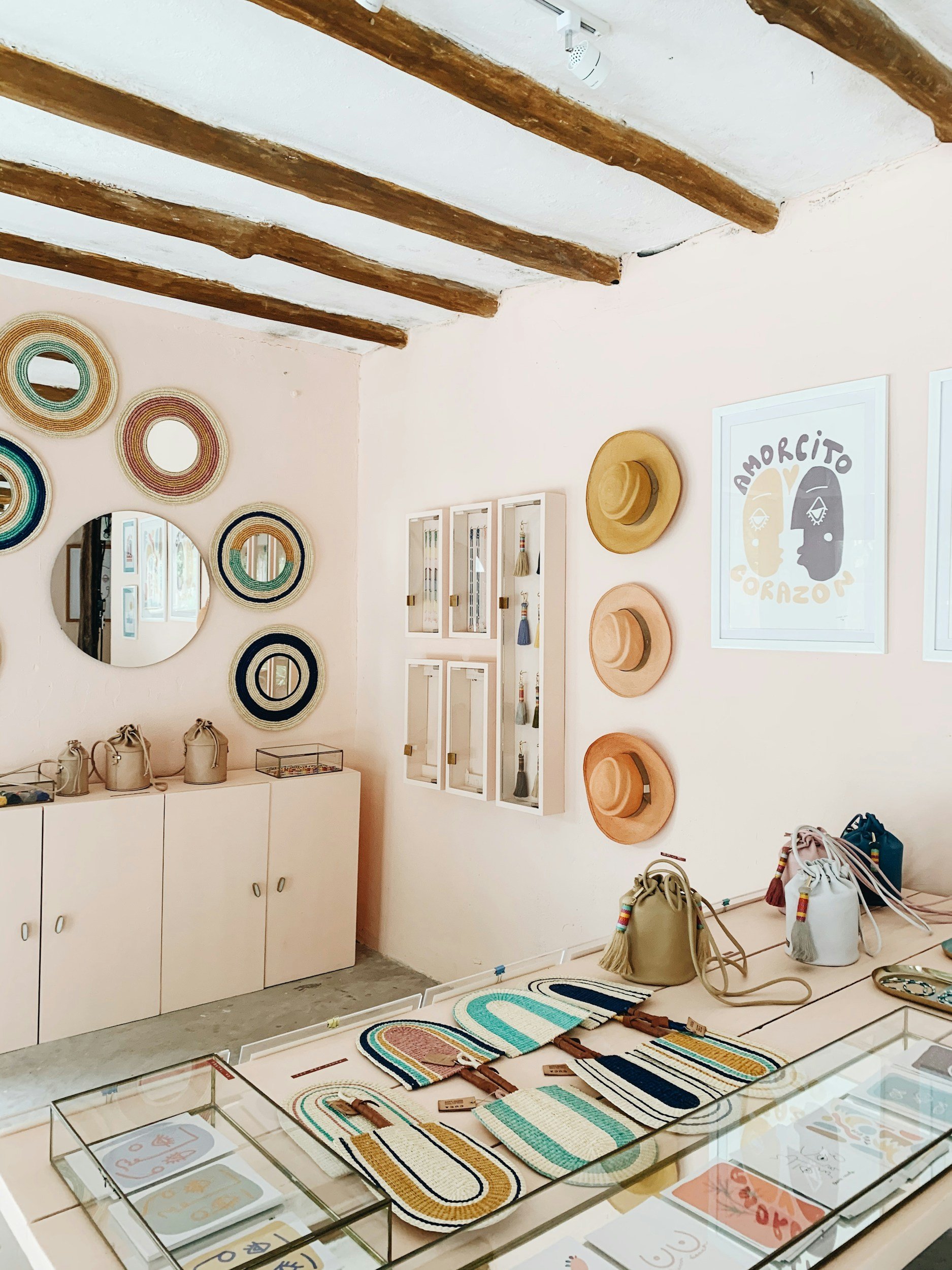 Curated handmade goods displayed in an artist collective retail space. Unsplash photo by Anna Sullivan