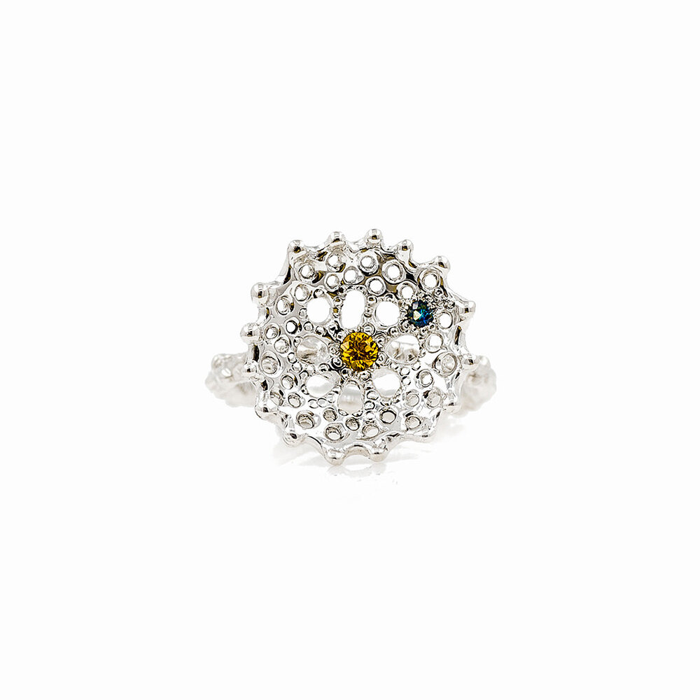 Yellow and blue Australian sapphires are set into this carefully textured silver radial ring.