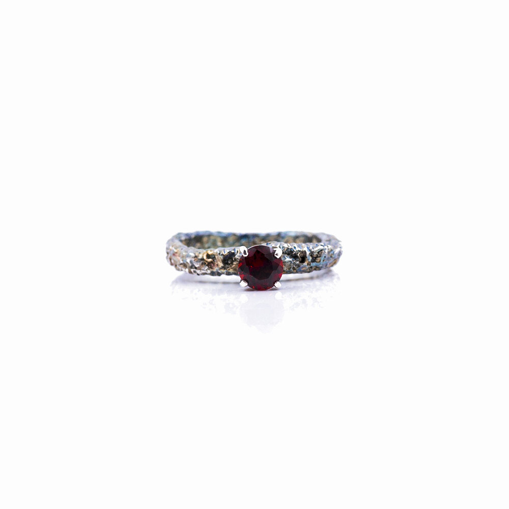 Graceful Inner Islands Solitaire Ring | Sterling silver, garnet, patina.