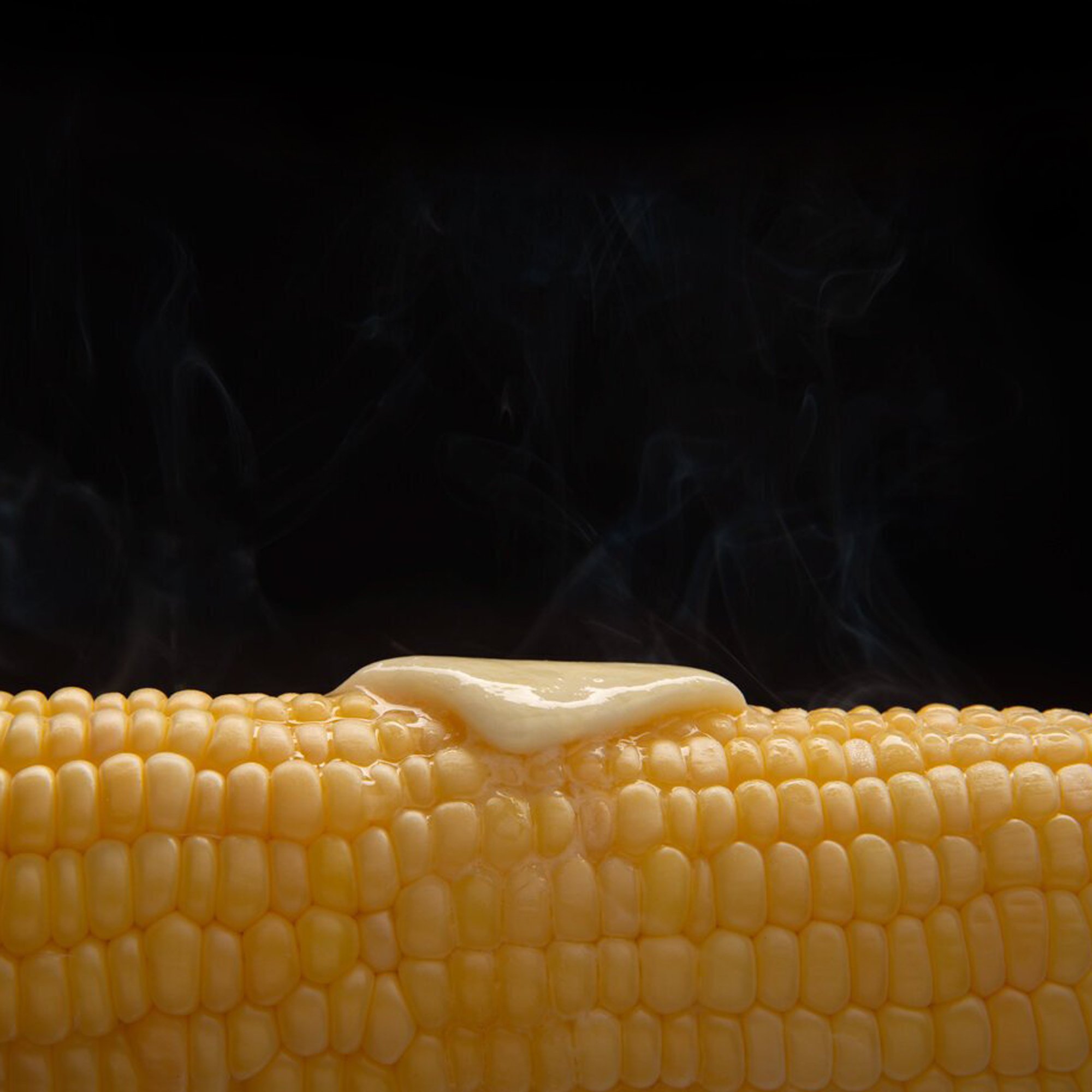  Corn on the cob steaming hot with a pat of melting butter 