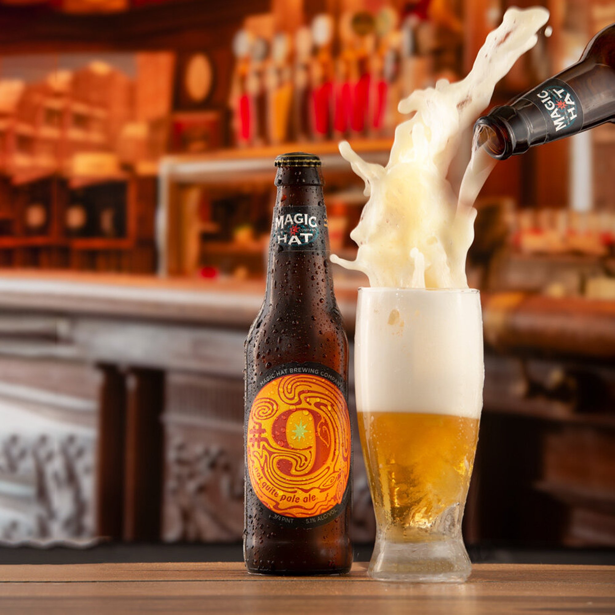 Beer beverage pour shot styled with a bar background the pour is a creative beer blast. 