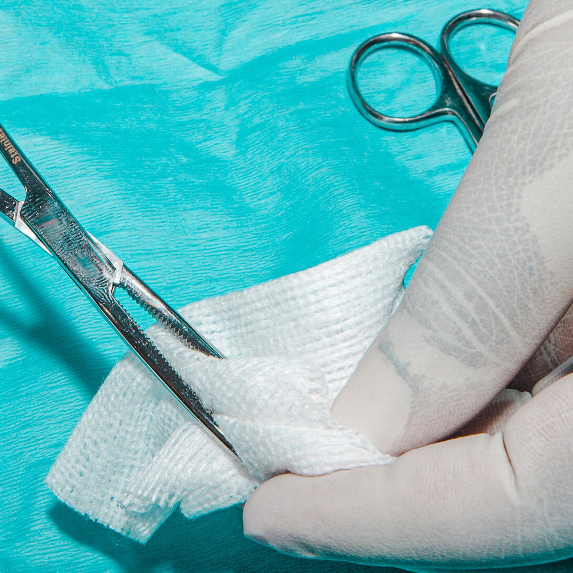  Location-based photography shows off your business and how it operates. Photo of a surgical Technician loading a surgical sponge on a surgical clamp. 
