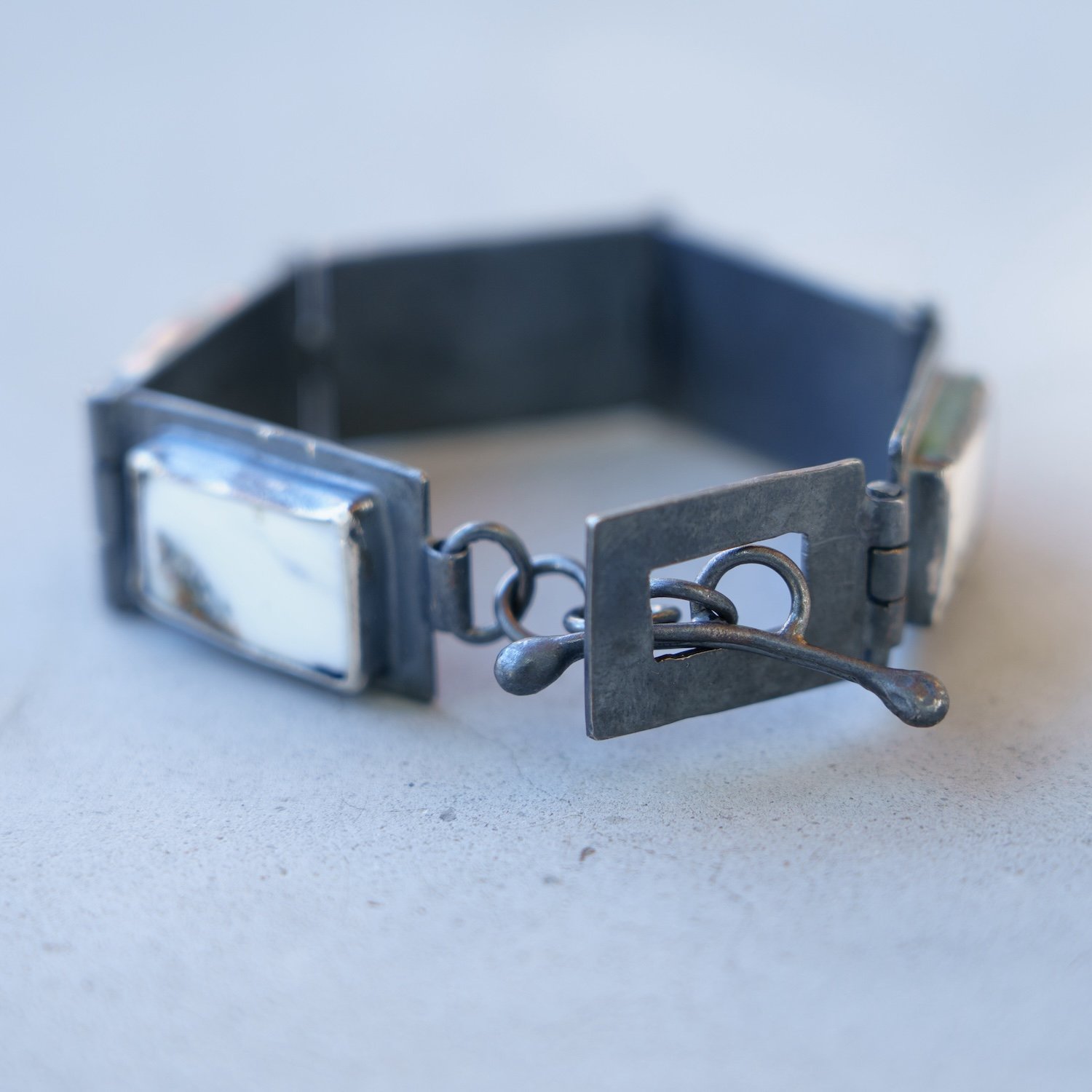 Hinged Bracelet:White Buffalo on blackened SS links #2.jpg