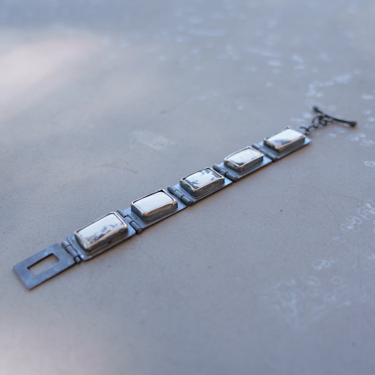Hinged Bracelet:White Buffalo on blackened SS links. #4.jpg