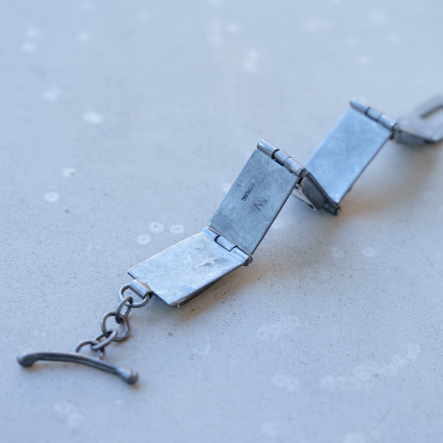 Hinged Bracelet:White Buffalo on blackened SS links. #3.jpg