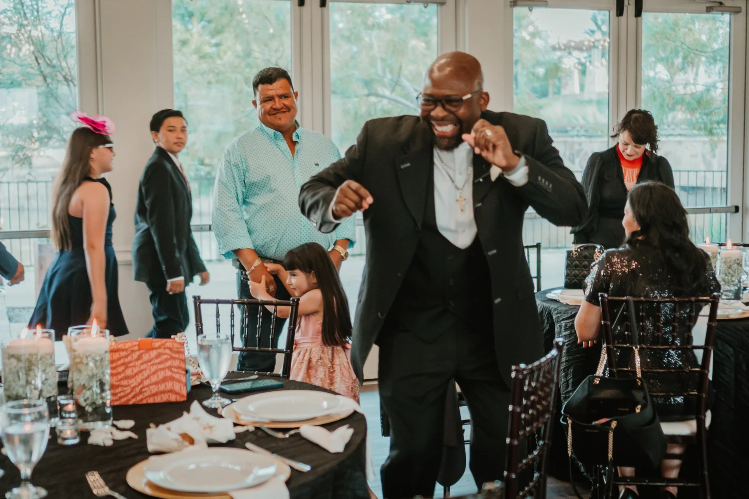 Guests dancing joyfully at the wedding reception