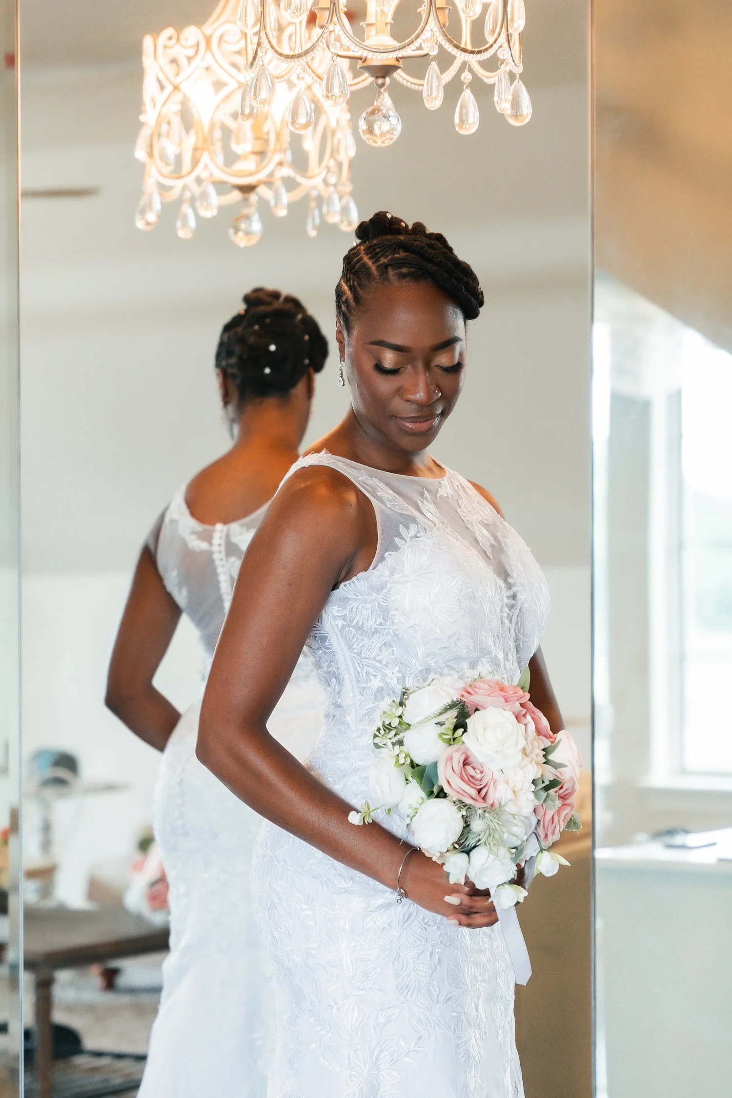 Bride holding a pink and white bouquet