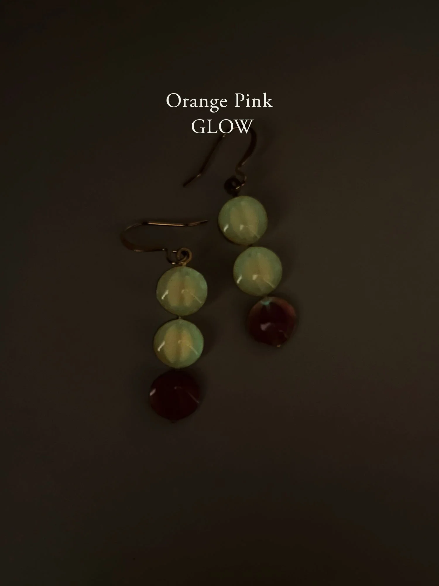 Juno Earrings in Orange/Pink glow in the dark.
