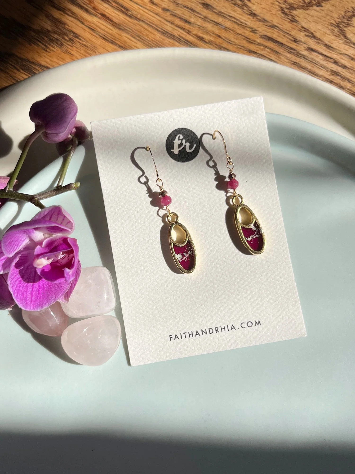 Niki Earrings on a Faith & Rhia Jewelry card in strong sunlight