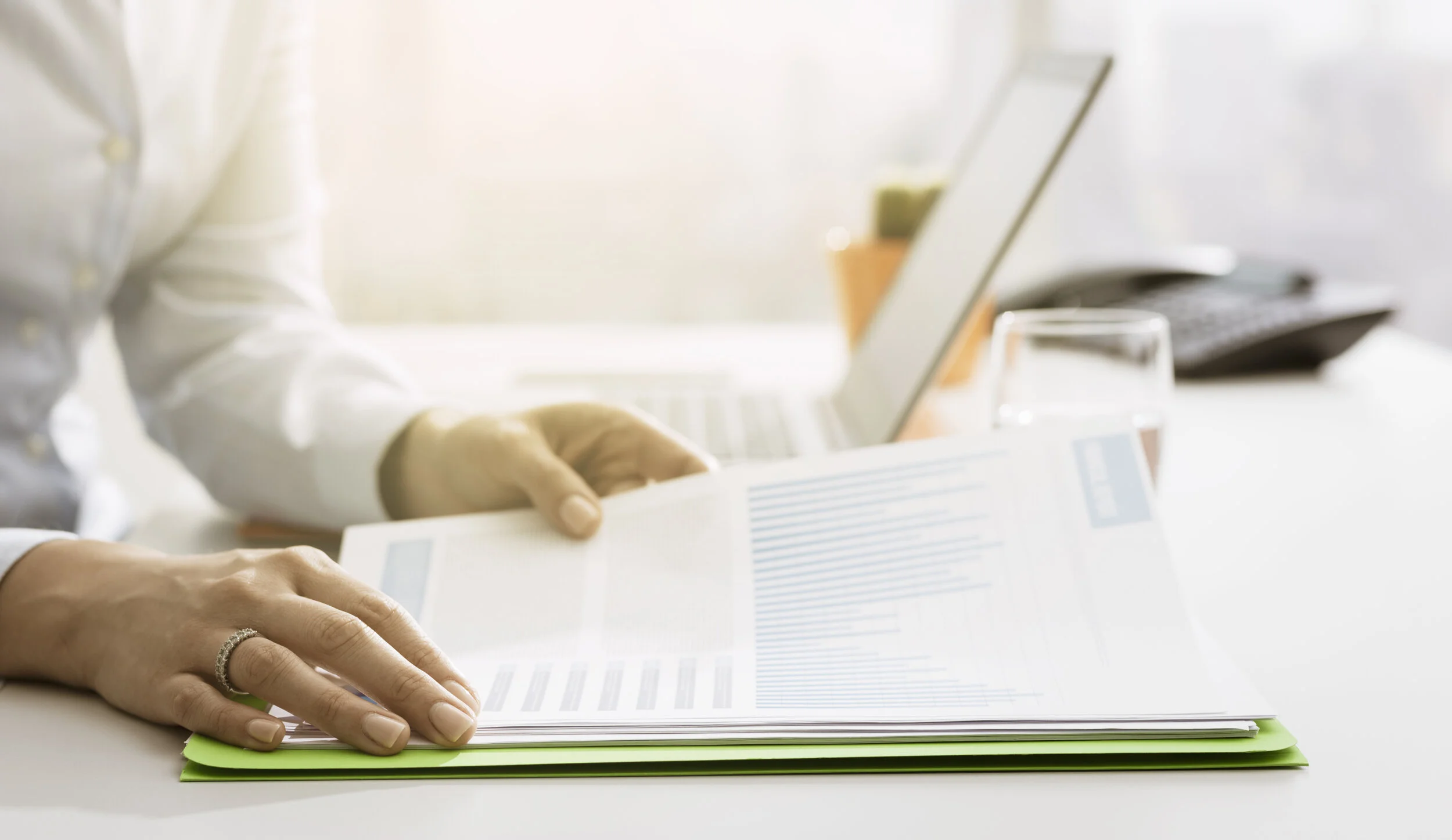 businesswoman-checking-financial-reports-and-state-.jpeg