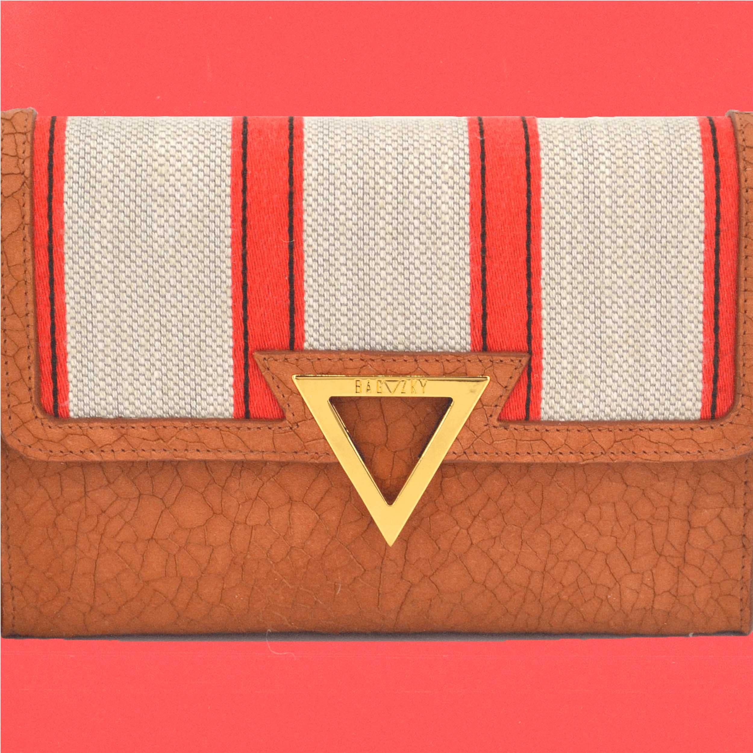 Namib Clutch infront of red background.