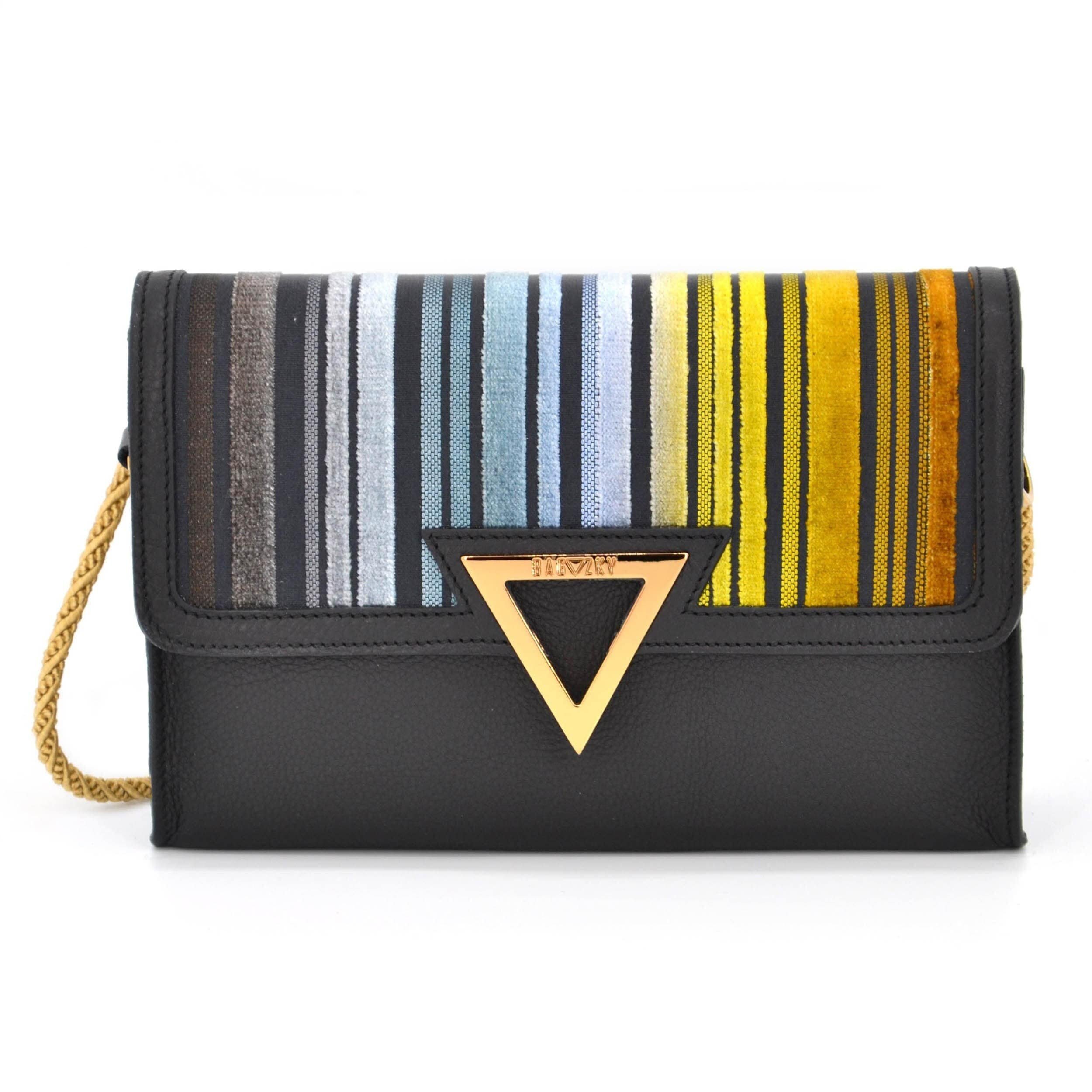 Front view of the black purse. it´s made out of black leather and a colourful striped fabric. The colors range from anthracite to different hues of blue to a rusty golden tone.
