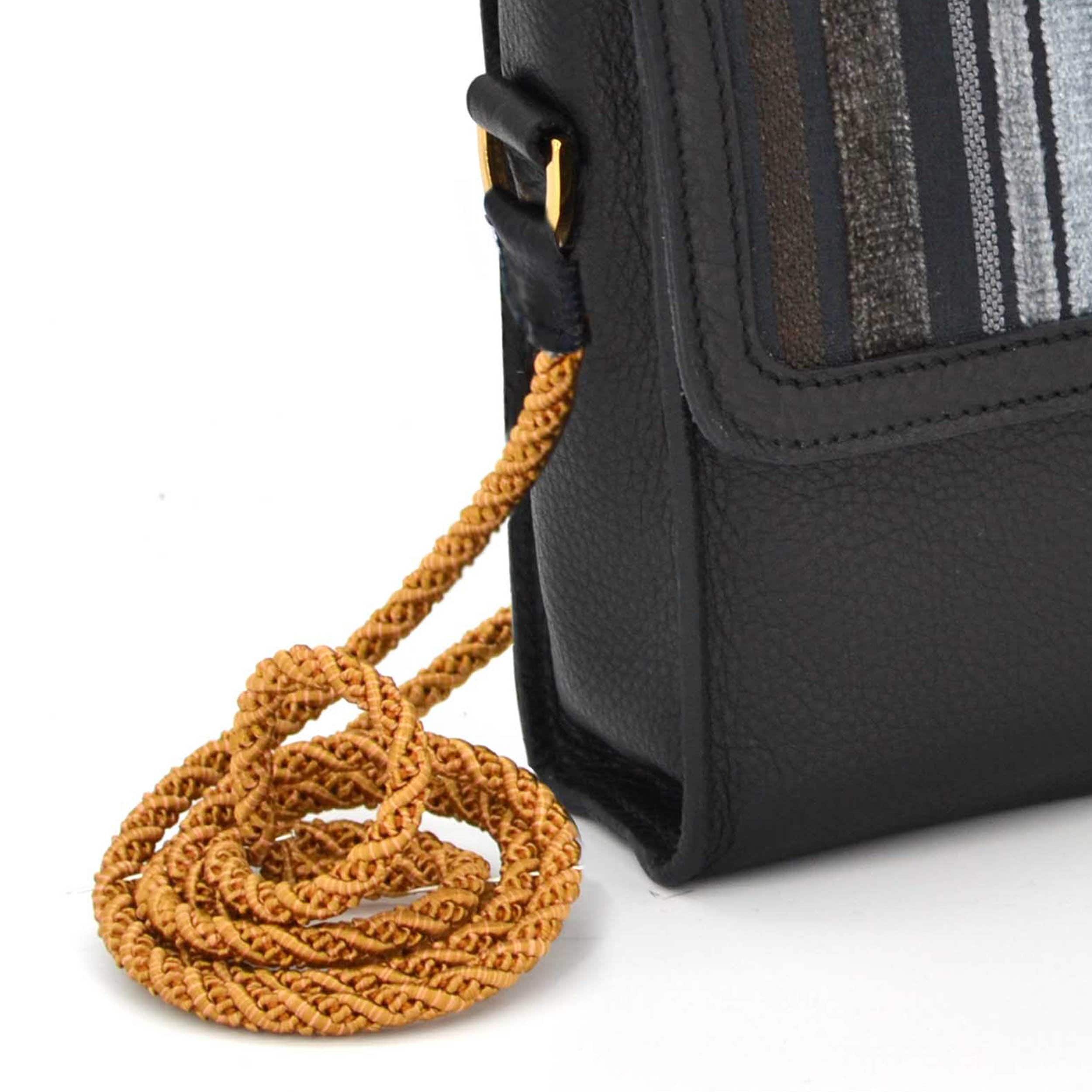 Closer look on the passament cord. It´s handturned and twisted of three strands. The golden tone matcheds with the Bagazky Emblem.