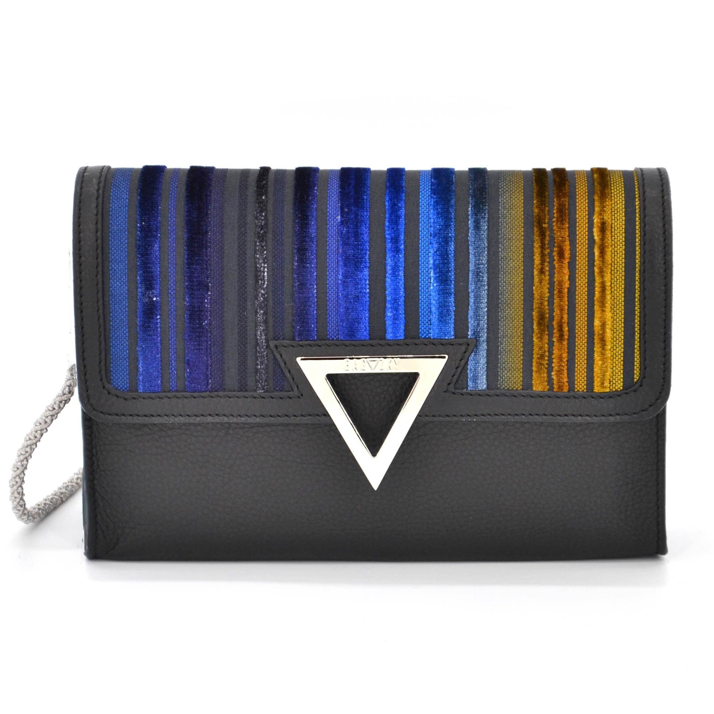Front view of the black mini handbag. It´s made of smooth leather and is combined with a striped fabric. The stripes symbolize the different shades of dawn.