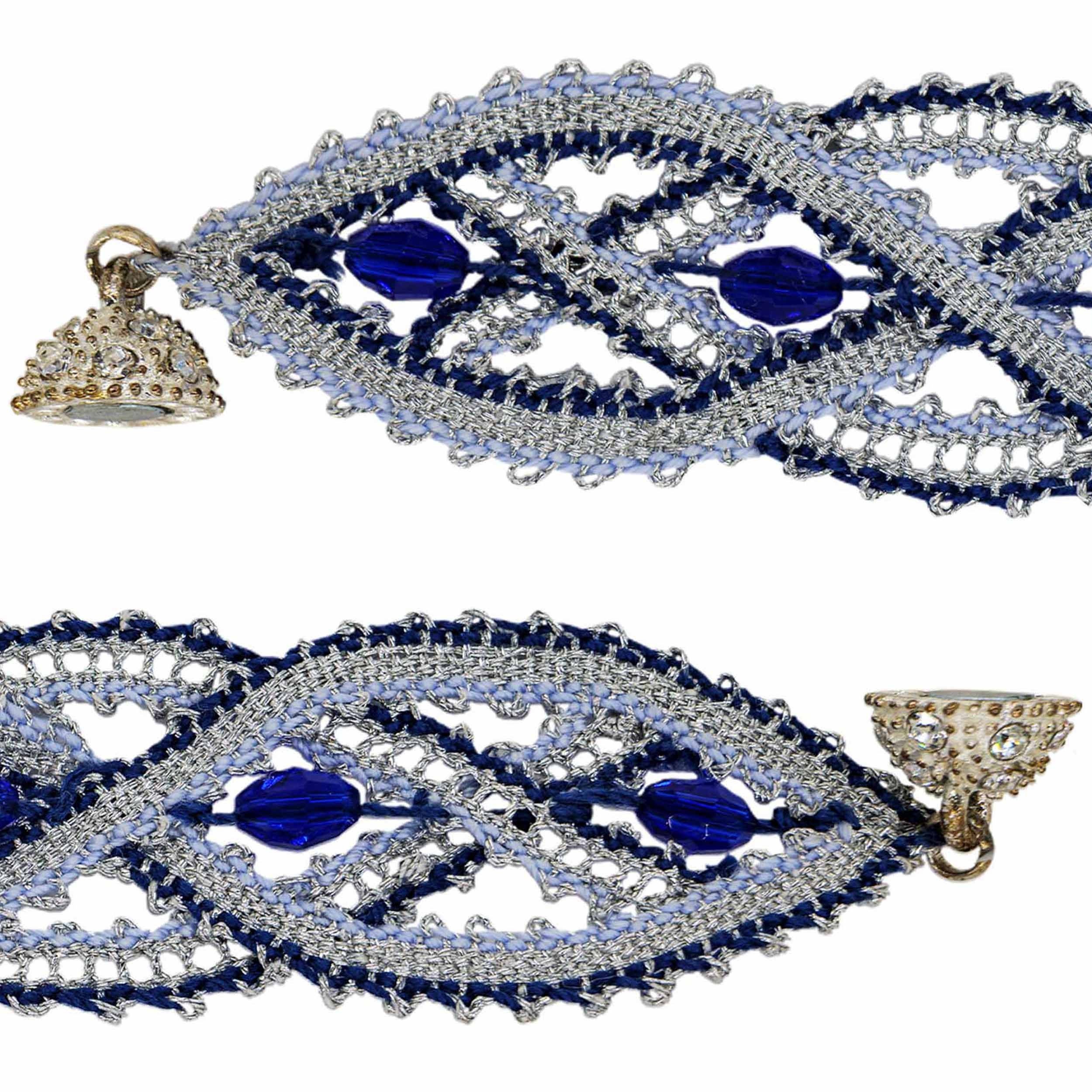 Shimmery silver and blue wristband, handcrafted according to a centuries-old lace technique.
