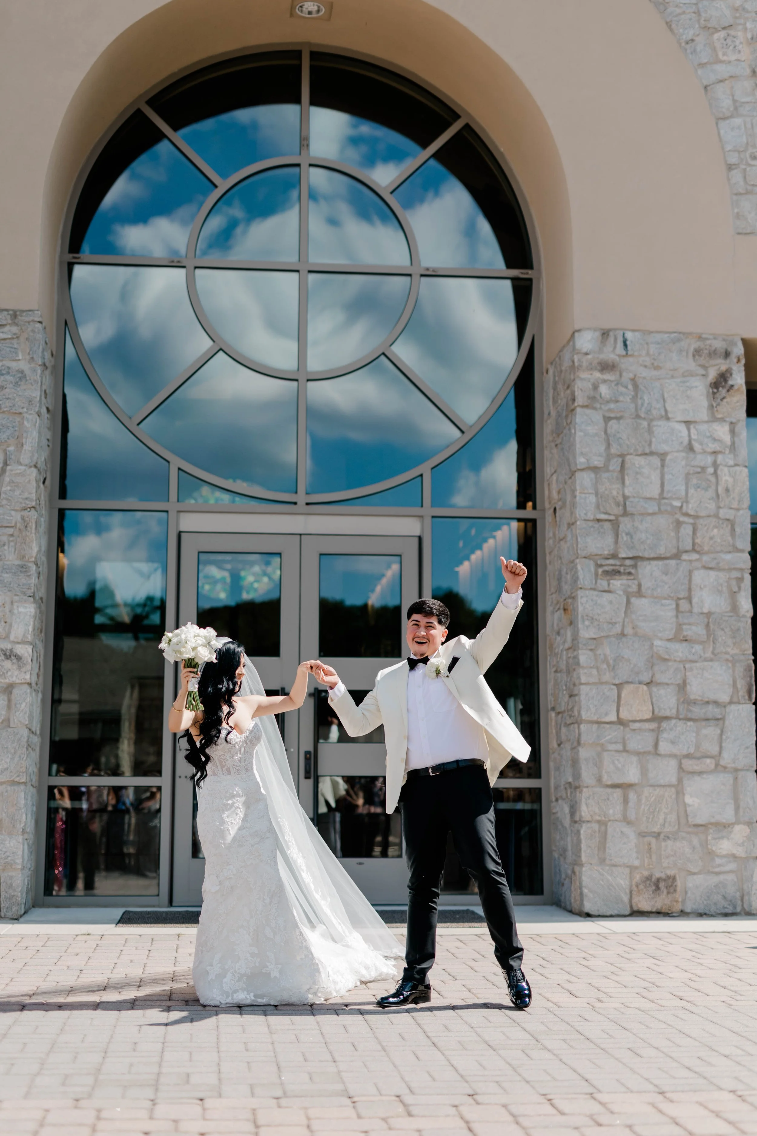 Newlyweds celebrating as they exit their ceremony