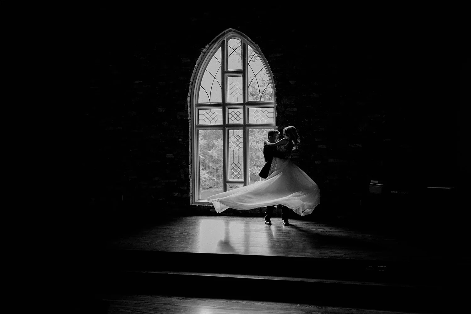 Bride in an arched chapel window