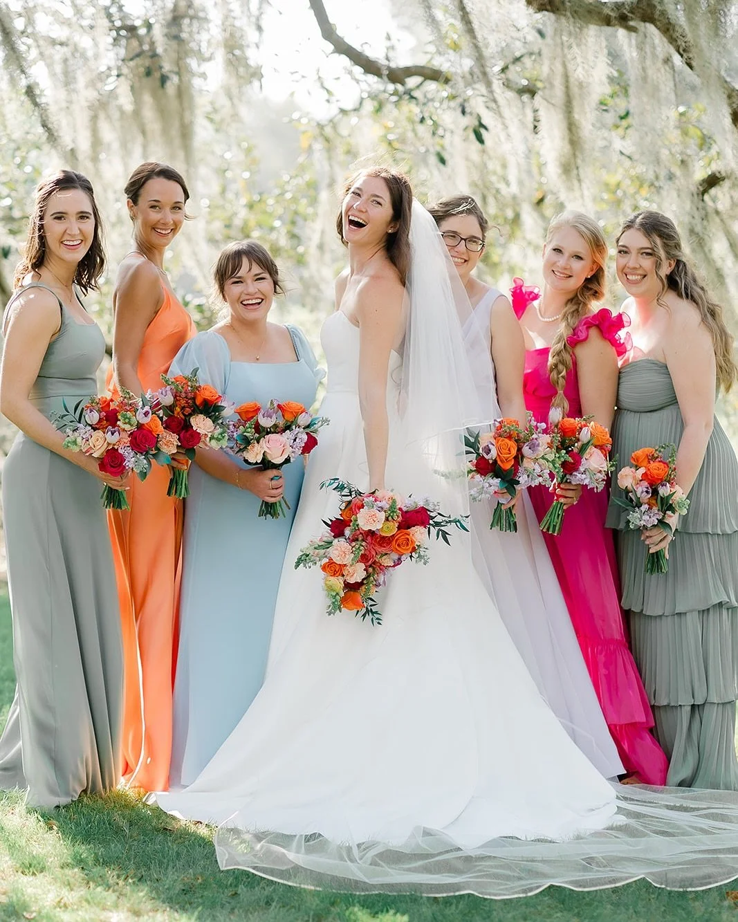 Colorful, fun, and full of personality - these dresses and florals are giving major celebration vibes! 💐

Photographer: @ardensea
Planner: @keepitcalm_events 
Venue: @sugarcane_farms
Florist: @shayfloral
Officiant: @notarizingtampa