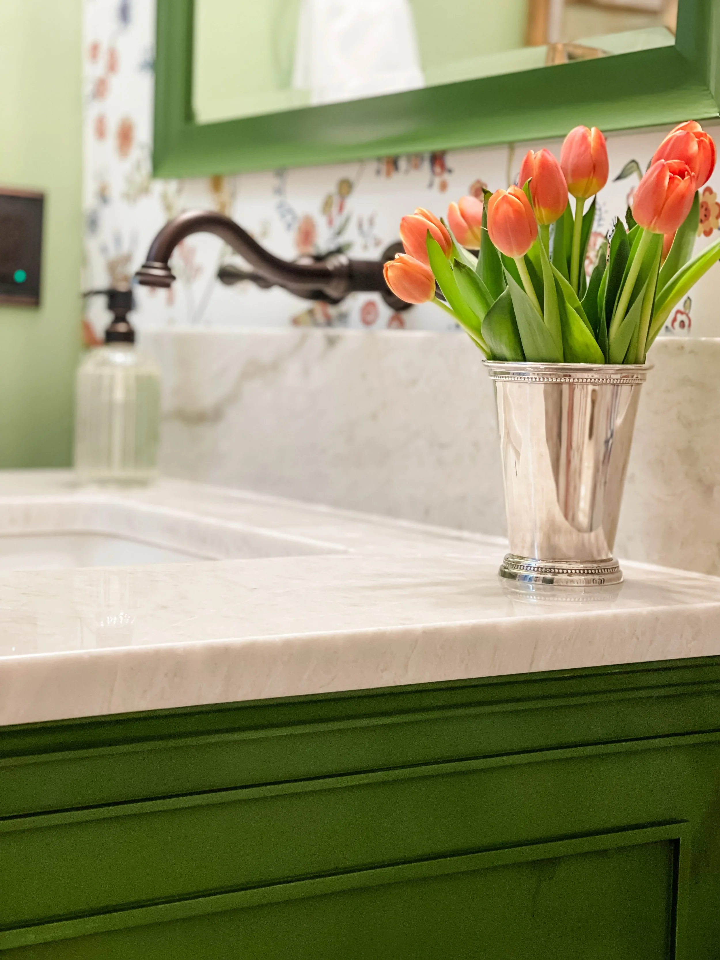 Another sneak but of this recently completed powder bath project. I always love how flowers can add so much to spaces like these. #interiordesign #powderbath #bathroomdesign #classicstyle #greencabinet