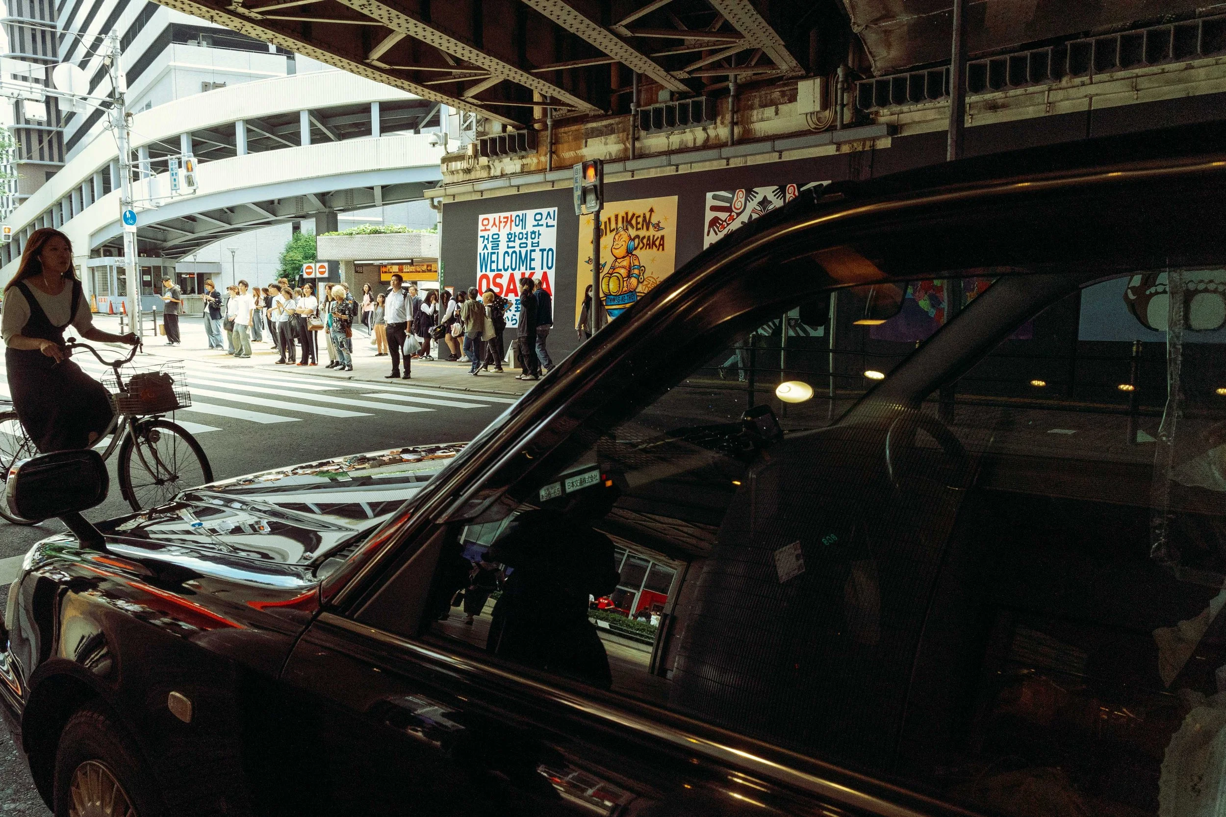 taxi, bike and pedestrians in Umeda, Osaka
