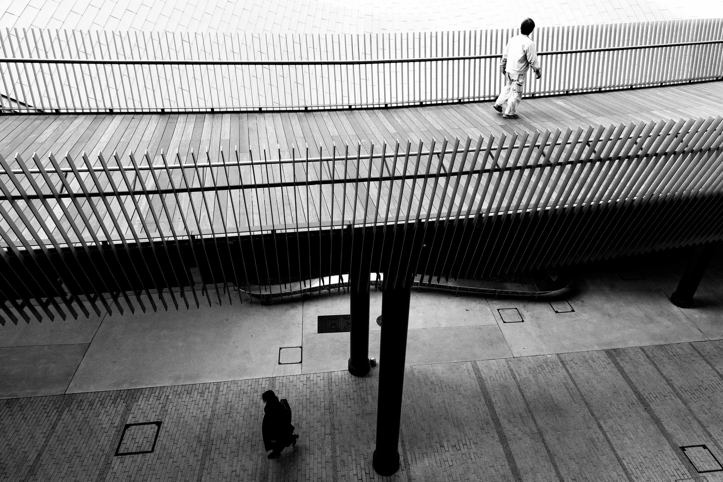 black and white image of people waking at Osaka Grand Green
