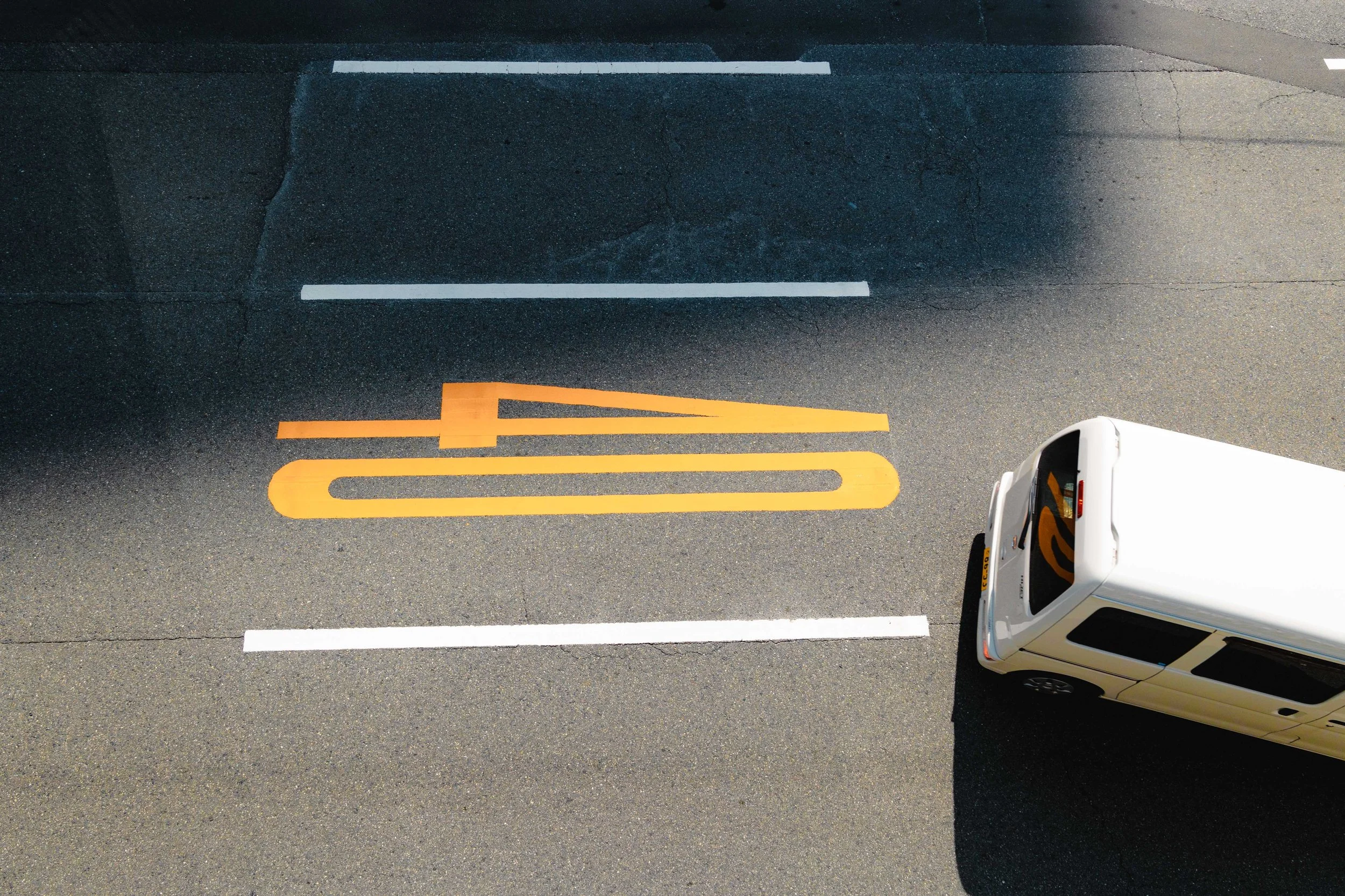 bird's eye view of japanese key car changing lanes