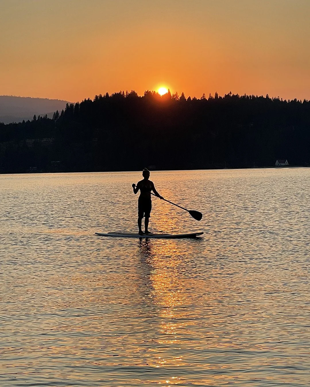 Stand up paddleboarding on Lake Coeur d'Alene, Idaho
