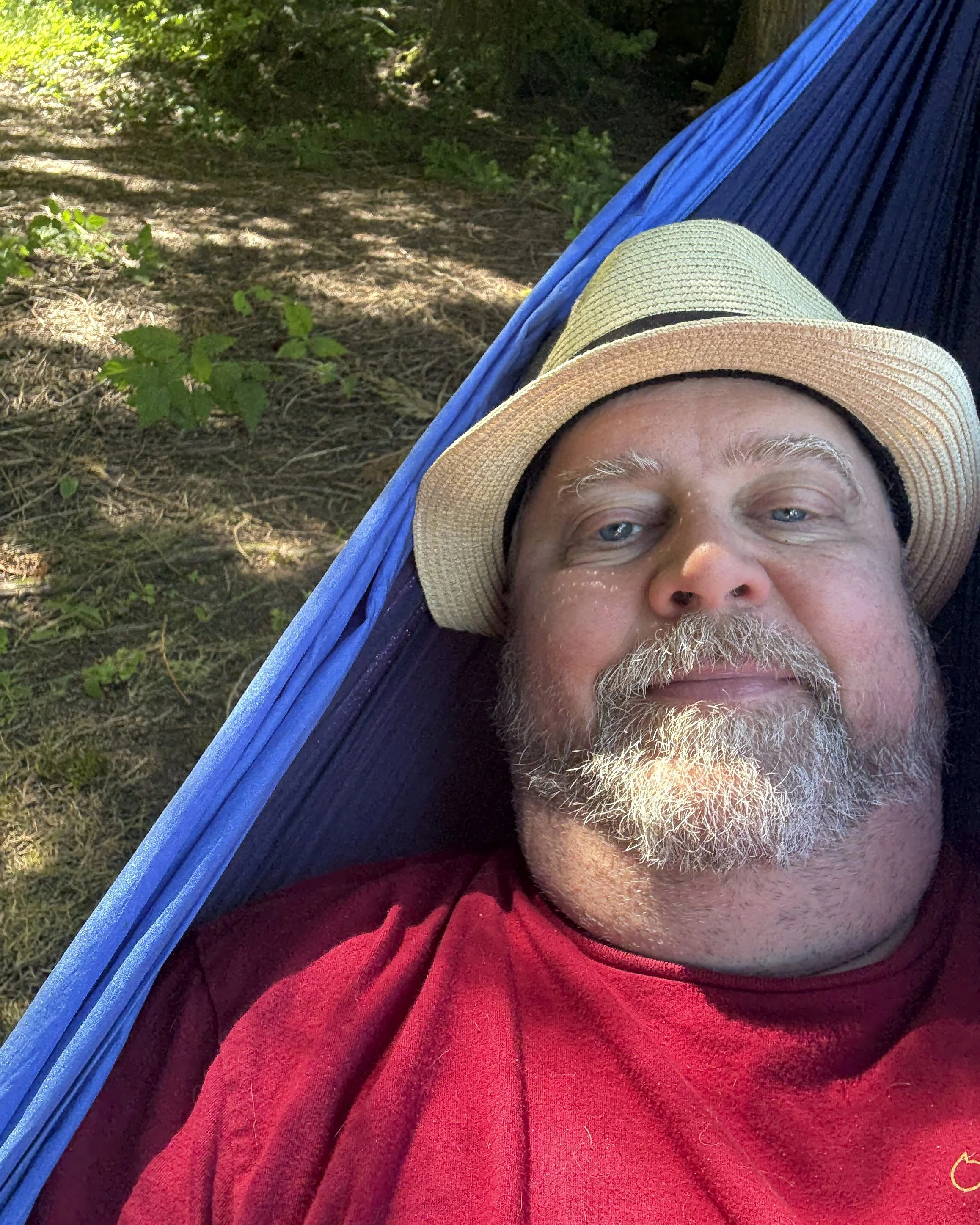 Podcast host Brooks, relaxing in a Eno Double Nest Hammock in camp