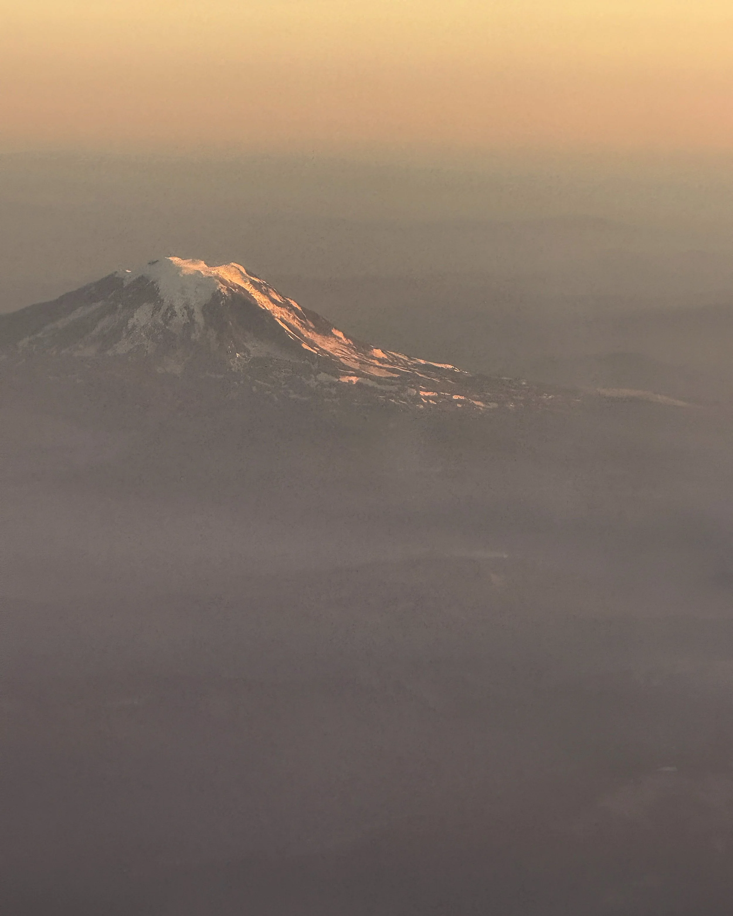 Mt Rainier poking above the clouds