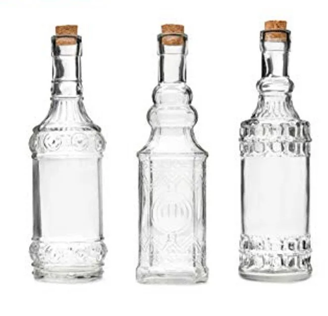 vintage style embossed tall glass bottle