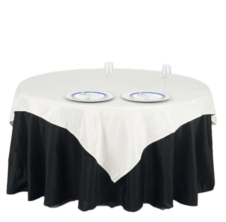 Square polyester tablecloth in ivory measuring 70 x 70 inches