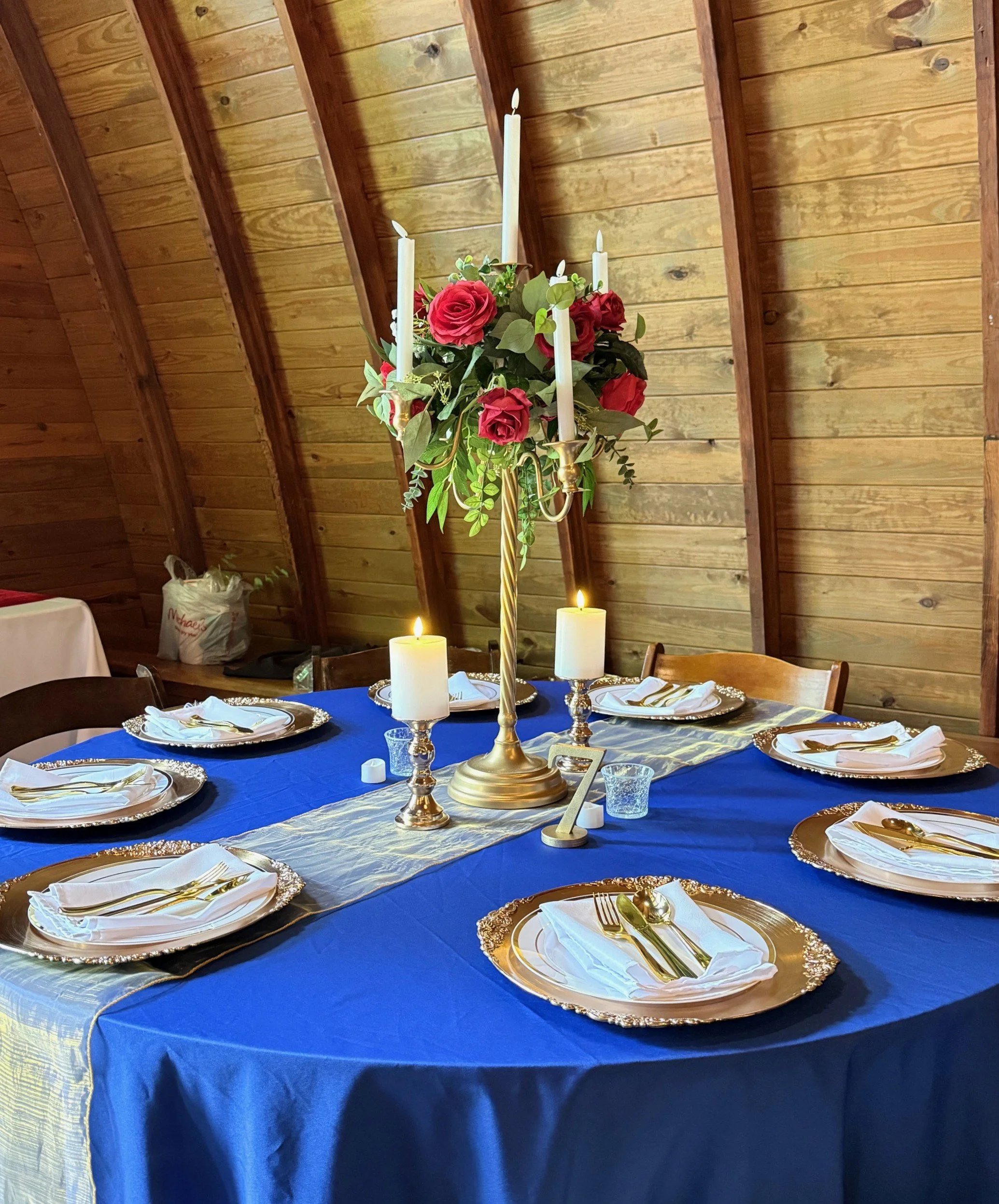 28 inch gold candelabra with red roses Beauty and the Beast themed wedding.jpg