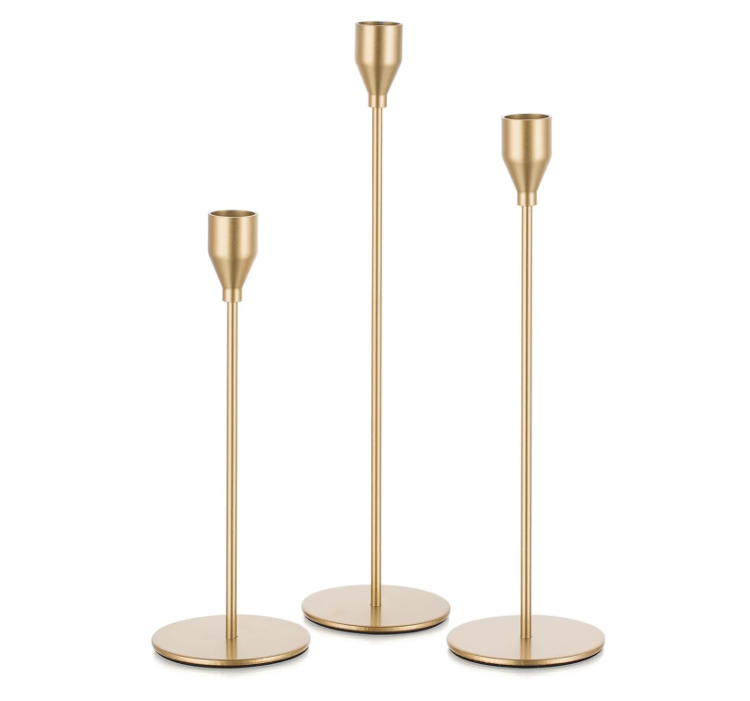 Modern slim gold candlestick trio.png