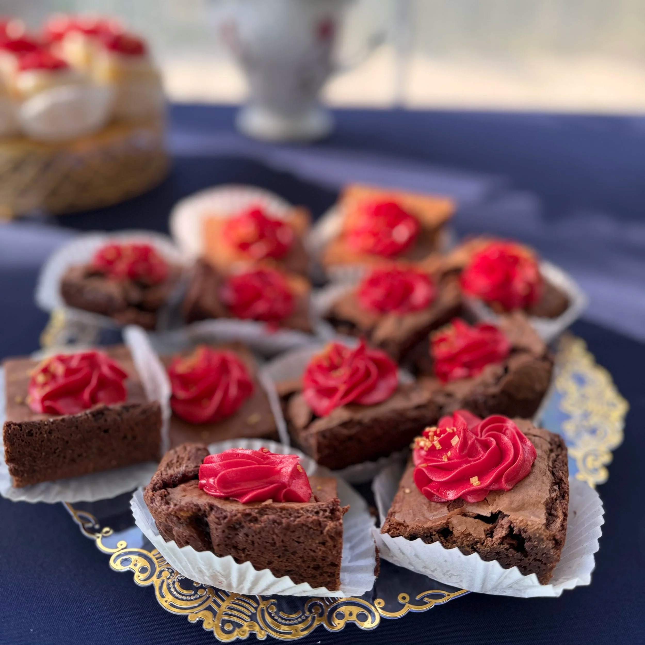 bite sized brownies topped with a red buttercream swirl and gold sugar dust from B's Bakery in Frankfort, KY