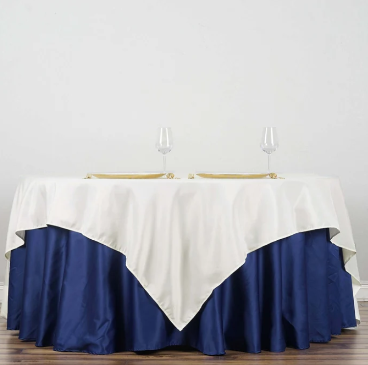 A square tablecloth in ivory polyester measuring 90 x 90 inches