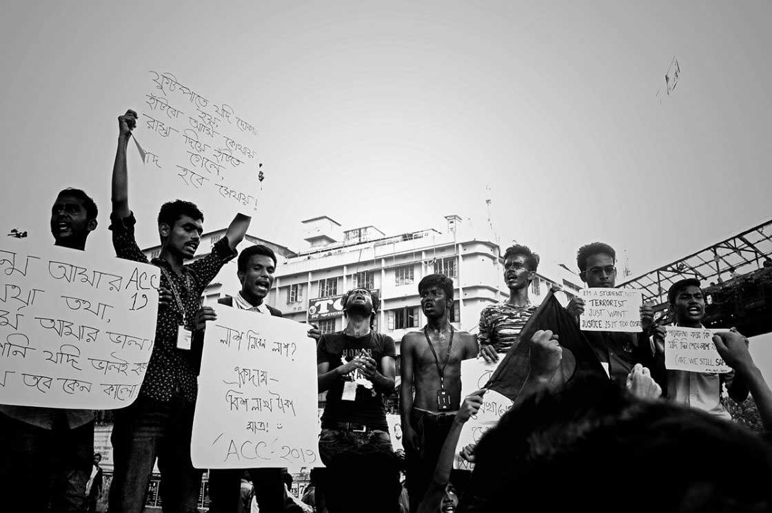   Students wearing face paint &amp; holding banners to protest the government’s butality.  