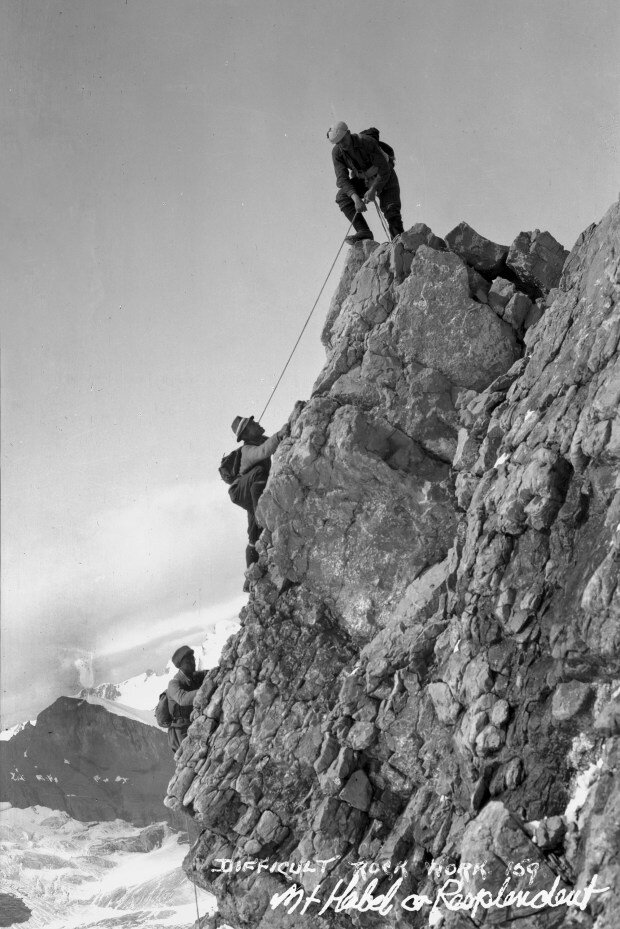   Conrad Kain, Albert H. MacCarthy and Basil S. Darling (from top) – Alpine Club of Canada camp at Mount Robson. 1913.     Photo by Byron HarmonCourtesy of the Whyte Museum of the Canadian Rockies, V263 / NA – 397  