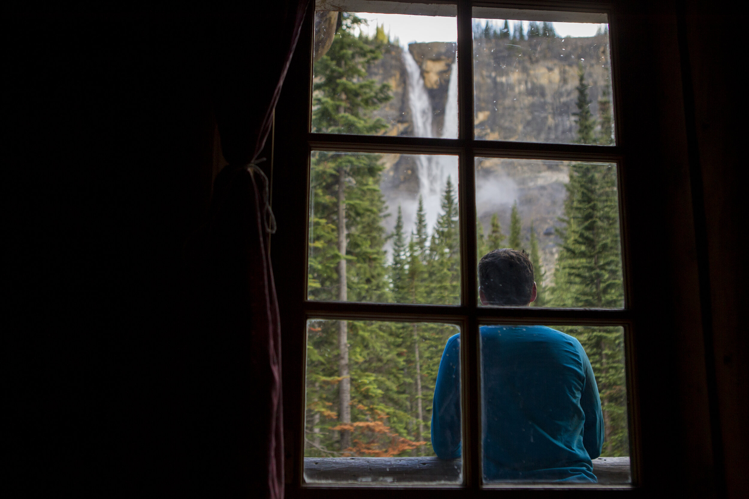  Outside the bedroom window – Andy on the balcony taking in the falls. Photo by Abbydell Photography. 