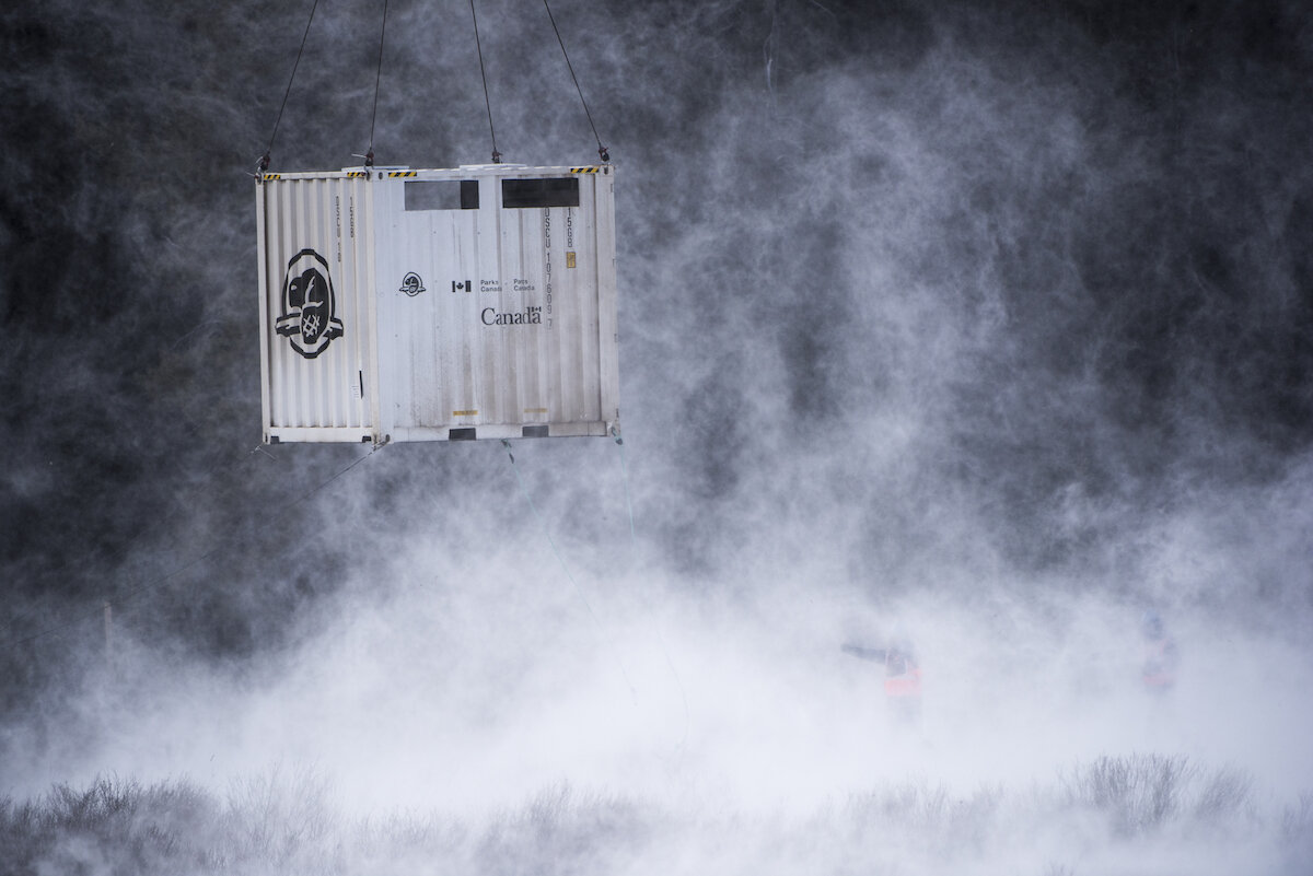  A custom shipping container carrying the first wild bison to Banff National Park in over a century arrives in the remote Panther Valley. Photo by Dan Rafla/ © Parks Canada. 