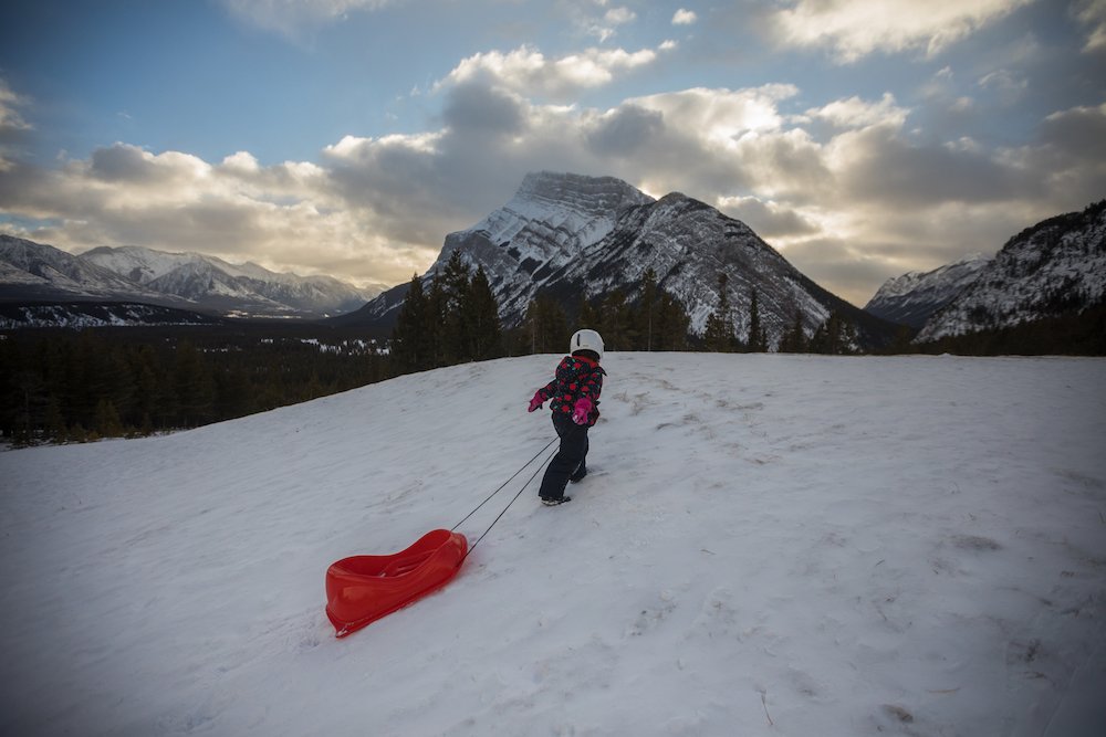  Sledding nearby. Photo by Paul Zizka Photography. 