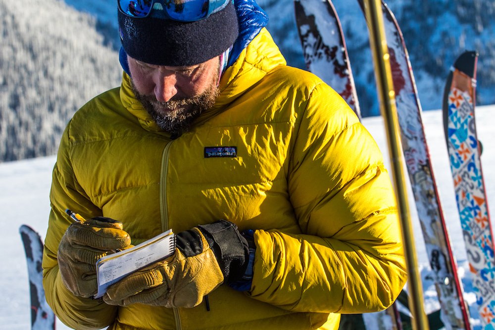  Course instructor Darcy Chilton notes the day's conditions. Photo: Ryan Creary. 