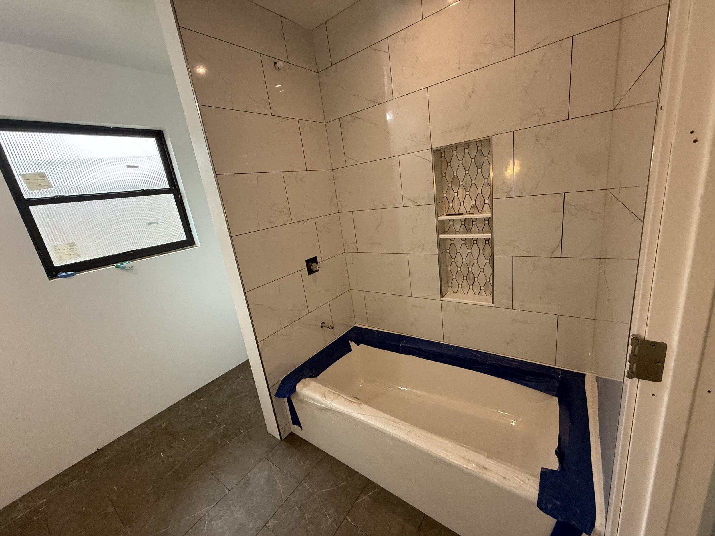 Tile wall and shampoo niche