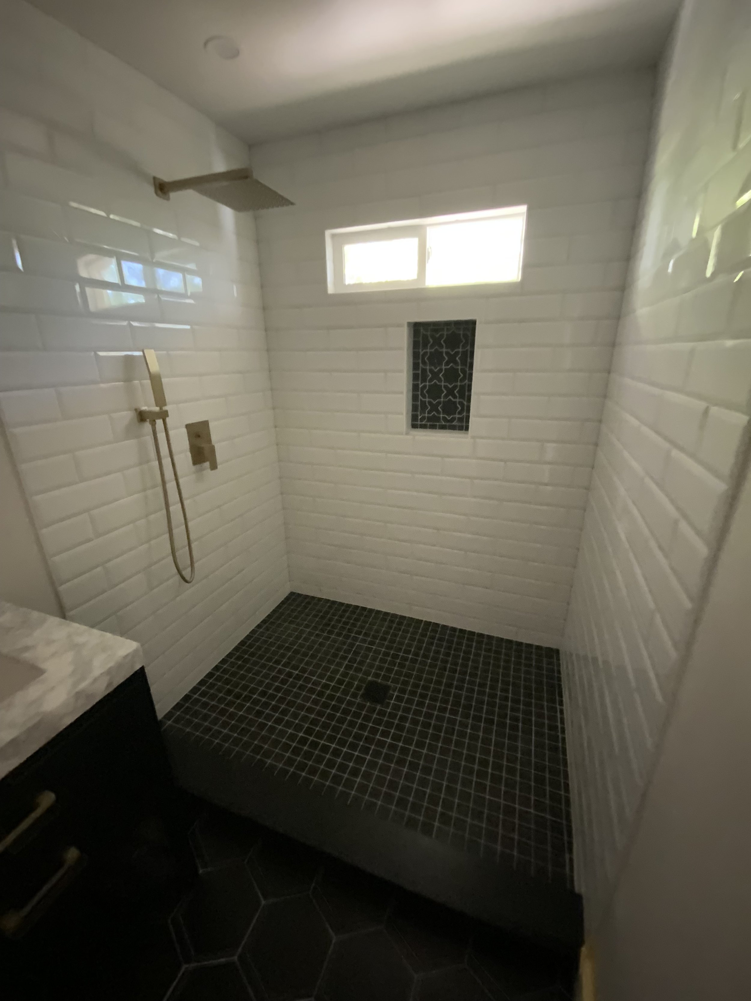 Bathroom floor and shower tiled