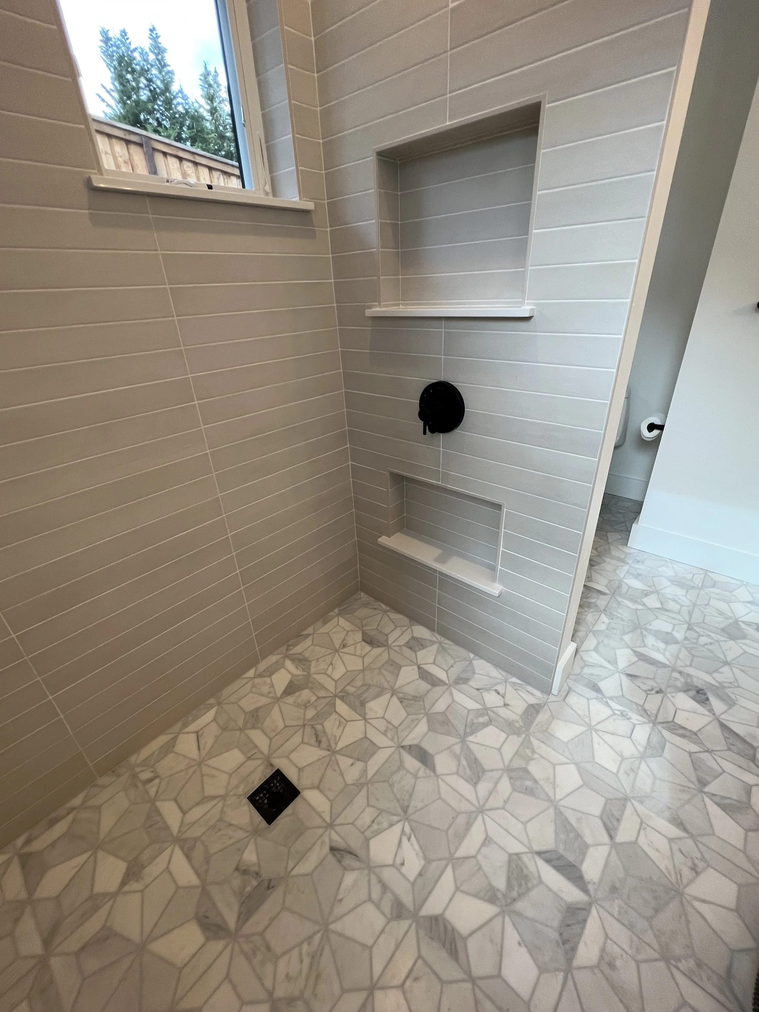 Shower walls and floor tiled