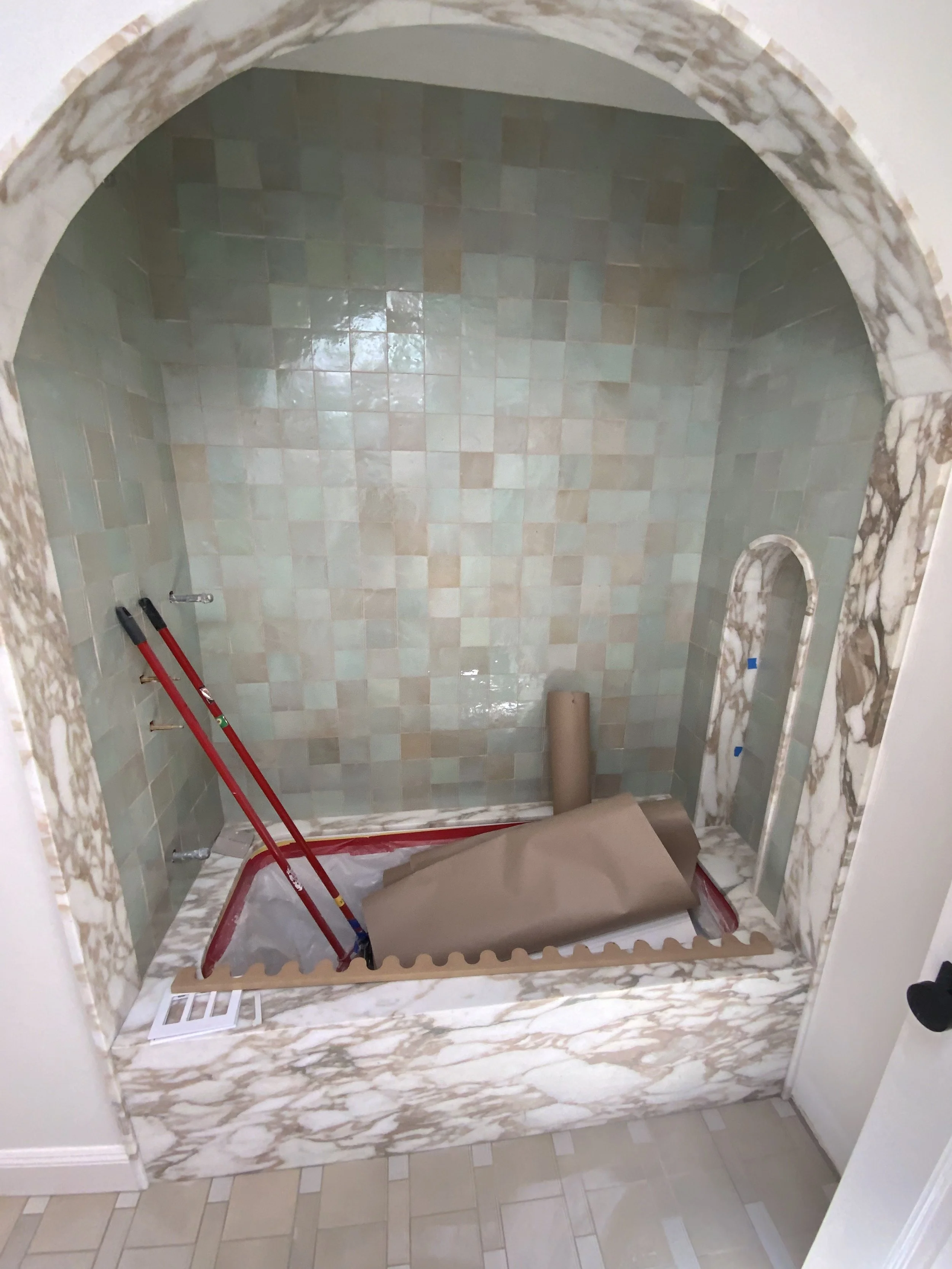 Built arch in bathtub enclosure & tiled it.